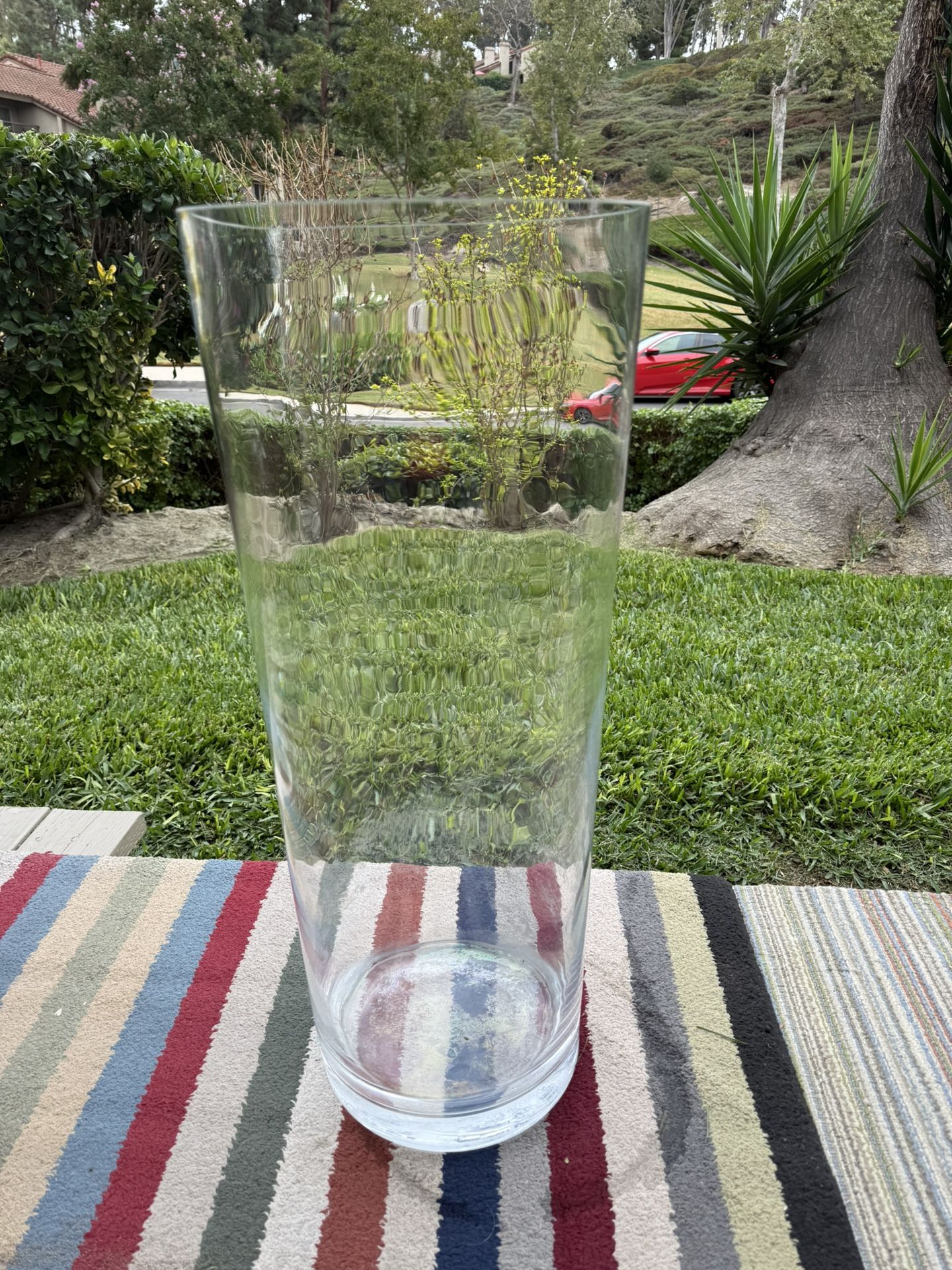 Large Clear glass vase, perfect for home decor, sizes 26” T X 10,5” W. Just $20 only. Was paid $75 in store. Good condition.