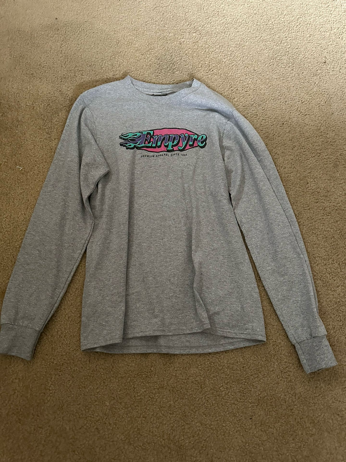 Grey long sleeve Empyre shirt with multi-coloured design