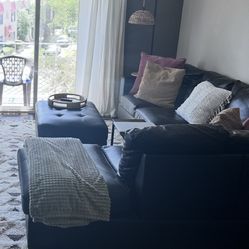 black leather sectional  + ottoman