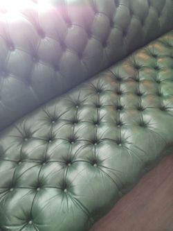 Vintage Hancock and Moore green leather Chesterfield sofa.