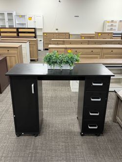 Black Office Desk with StorageāØFeatures a cabinet and 4 drawers for organized space.Easy to move with wheels and they lock in place for stability. Per