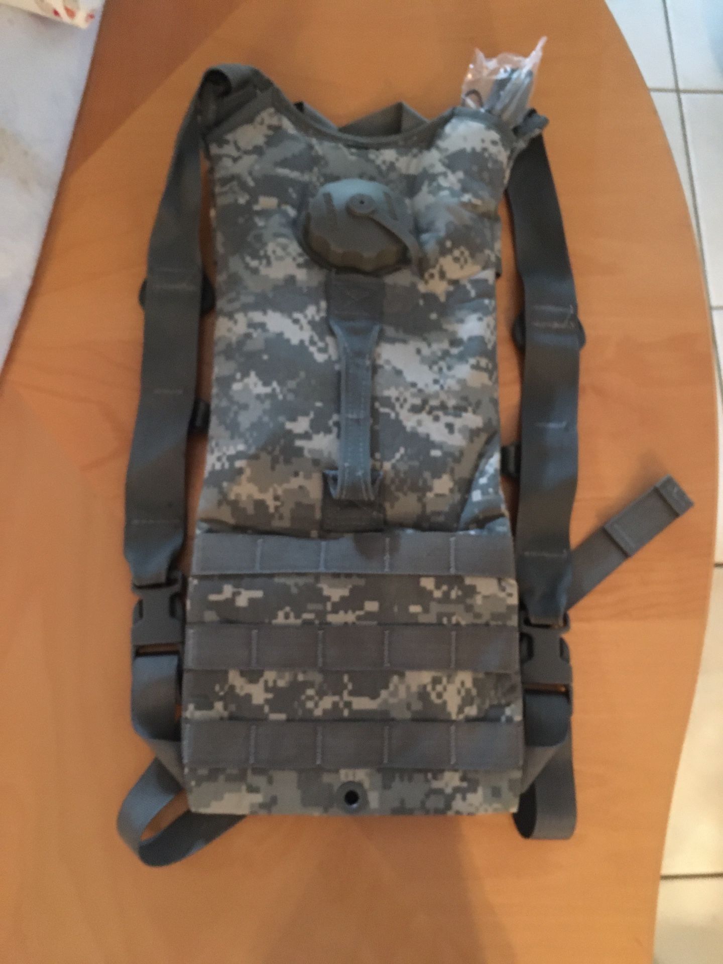 New Hydramax ARMY ACU MOLLE Hydration Carrier, with a 3L (100 oz) capacity. It's designed for carrying water during activities like hiking, camping, a