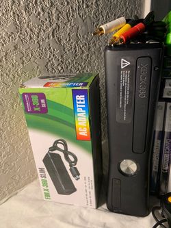 Xbox 360 Slim W/ New cords and plug ins.