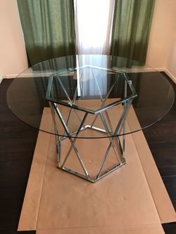 Glass table with silver modern base