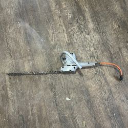 Old school corded electric hedge trimmers.