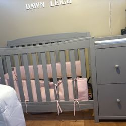 crib with changing table.