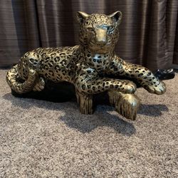 The Golden Leopard On The Log Statue