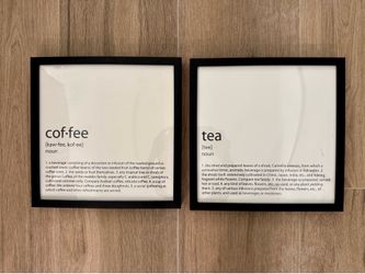 A pair of wall art prints in black frames