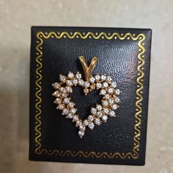 14 k gold diamond pendant.  Weight is 5.6 grams