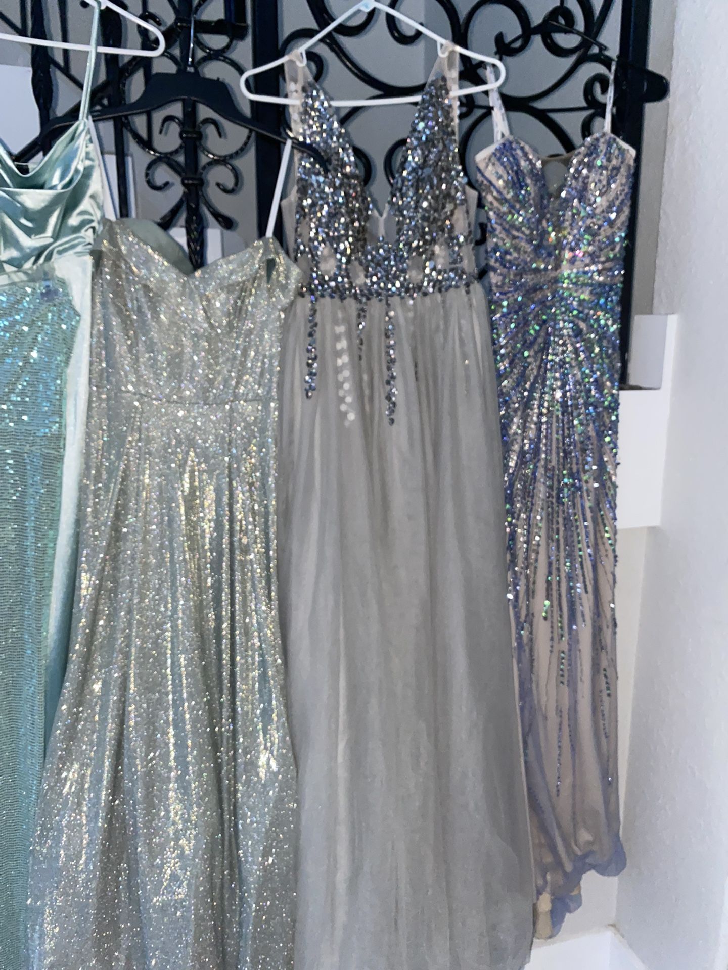 Several Blue Silver Aqua And White Gowns