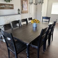 Dark Wood Farmhouse Dining Table with a leaf extension and 8 Matching Chairs
