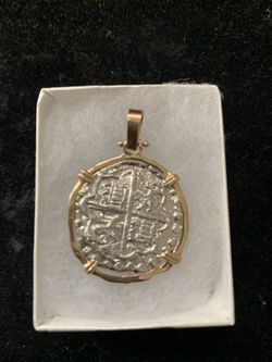 Atocha silver coin pendant in gold bezel