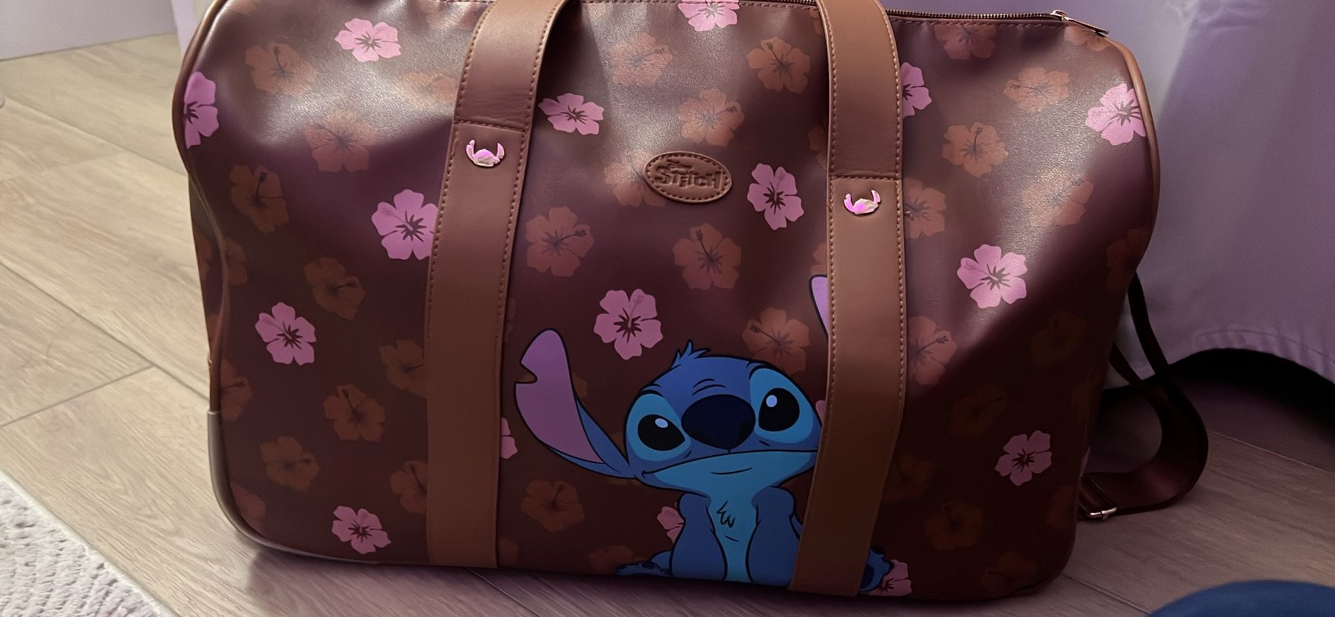 Stitch leather rolling duffel bag