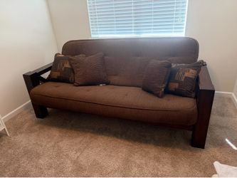 Solid wood sofa bed with pillows
