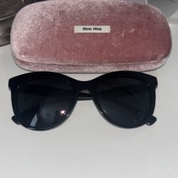 Miu Miu  MU08U Frame: Black Lens: Dark Grey Size: 54