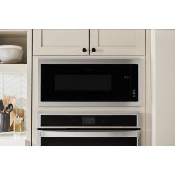 BRAND NEW IN BOX WHIRLPOOL BUilt IN STAINLESS STEEL MICROWAVE. $325.1 year warranty