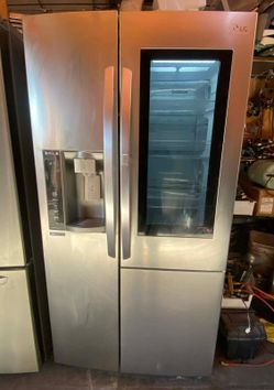 LG REFRIGERATOR SIDE BY SIDE WITH EASY ACCESS GLASS DOOR. FREE DELIVERY AND INSTALLATION