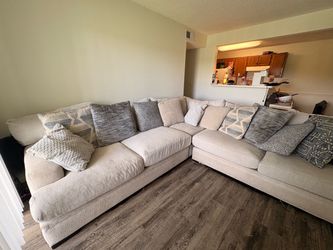 Beige L-shaped couch / sectional for sale