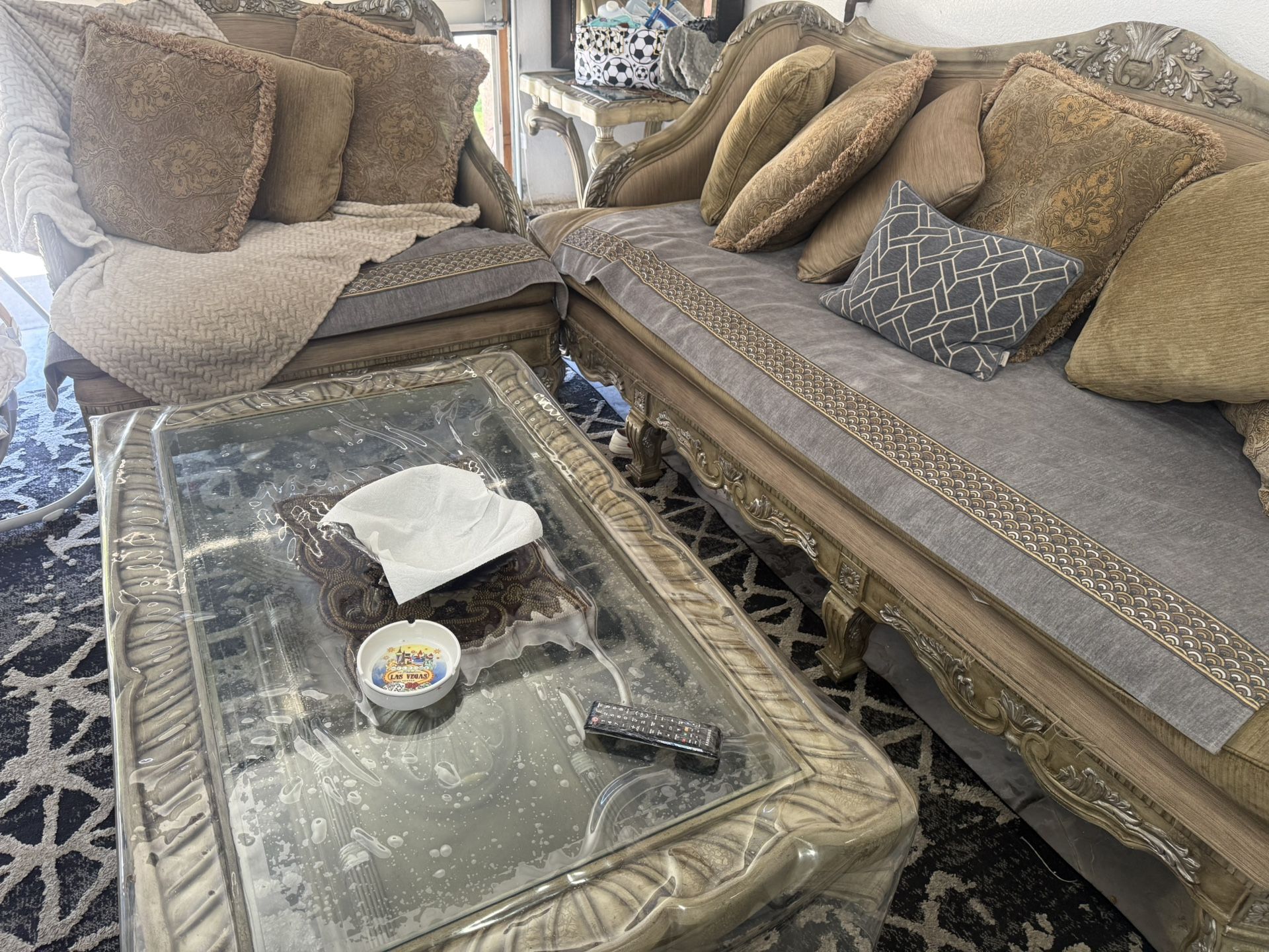 Dining table with six chairs and coffee table and small table and two couch one small one big