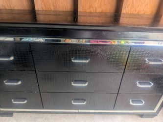 Black dresser with mirrored trim