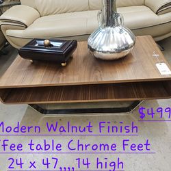 Coffee Table Walnut Finish w chrome feet We are located at 2811 East Bell road. Another Time Around Furniture.