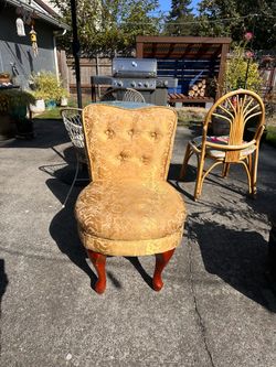 Gold upholstered ornate chair