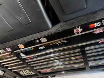 Mac tech toolbox black with chrome trim and wheels.