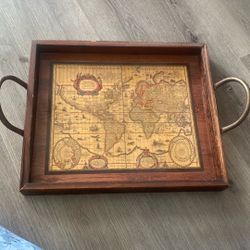 vintage-style wooden tray features a decorative map reproduction 