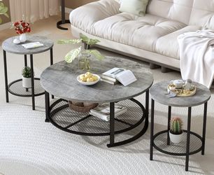 A set of three gray coffee tables