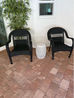 2 black whicker Chairs