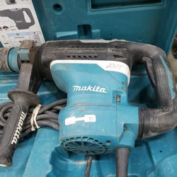 Makita HR4013C 1-9/16" SDS-MAX AVT Rotary Hammer in a blue hard case.