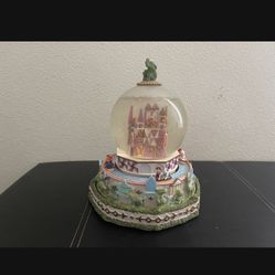 Disney small world snow globe