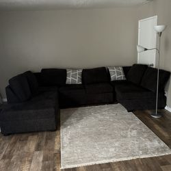 Large sized wraparound sofa
