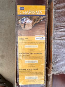 New Charisma Laminate Flooring, Glue Less, redwood color 126 square feet about.