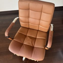 Tan leather cushioned office chair