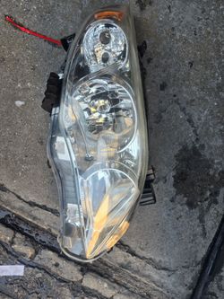 2012 toyota corolla le headlight
