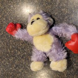 Purple ape with red boxing gloves plush toy 