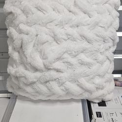 2 soft pillows and a blanket
