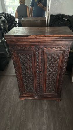 Hand-Carved Wooden Cabinet with Double Doors