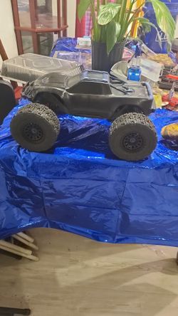 Trade for 2 self propelled push mowers .....4s traxxas Max in good condition this truck is a beast trust me..