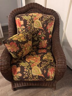 Dark Brown Wicker Armchair with Floral Cushions