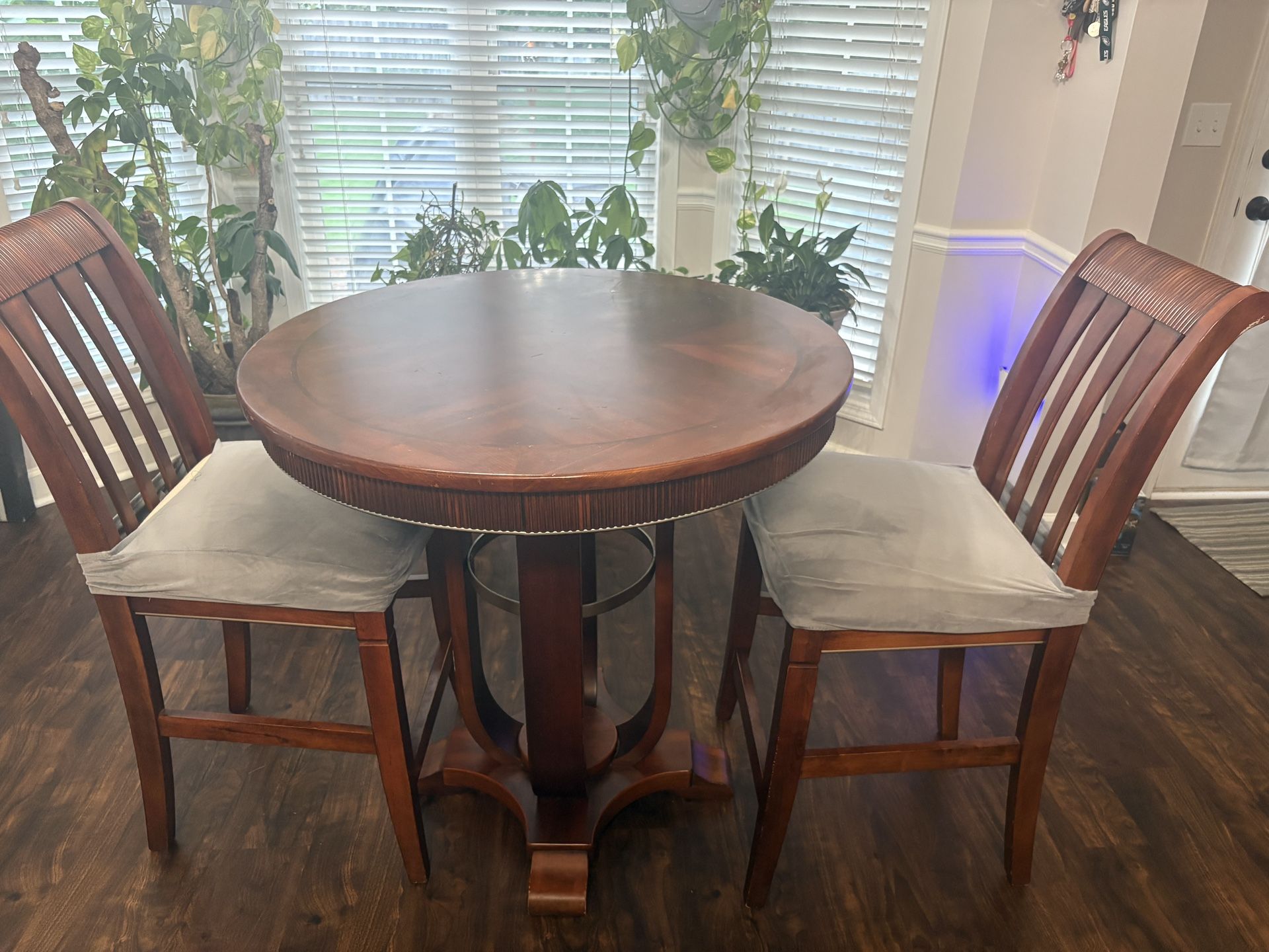 High-top round wood table with 2 matching chairs