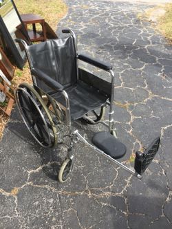 Wheelchair with extended leg holder.