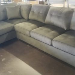 Chocolate reversible sectional with a matching ottoman