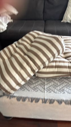 Stripped patio furniture pillows