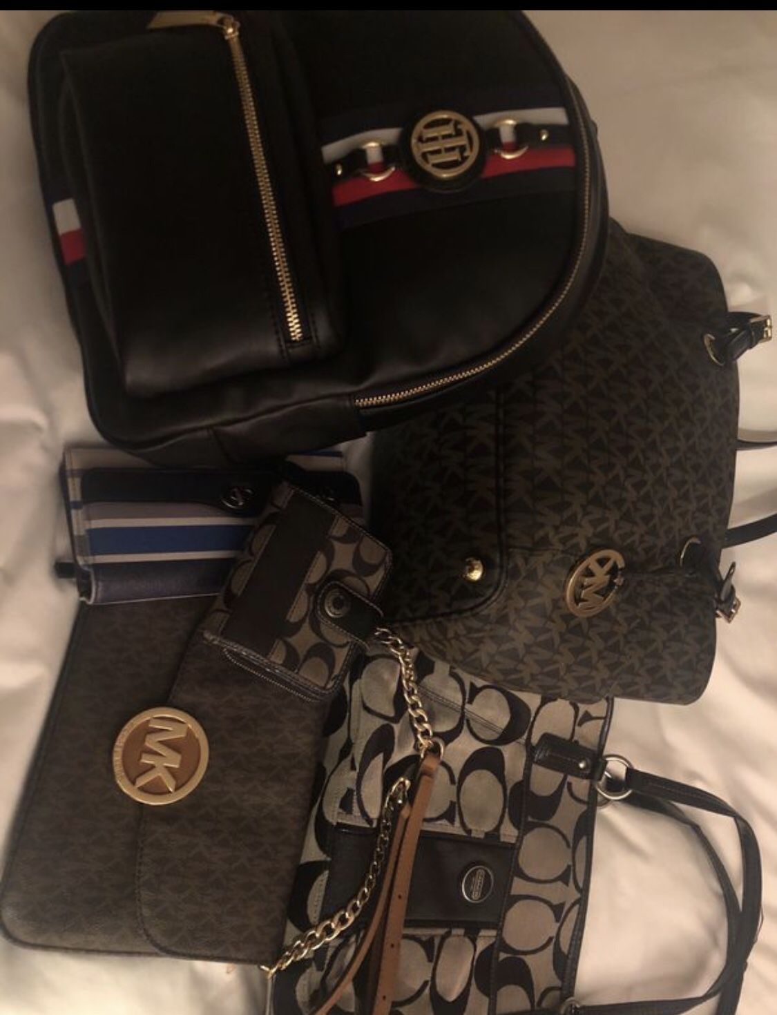 AUTHENTIC. Tommy Hilfiger Backpack, coach purse and wallet. Mk Crossbody Michael Kors. Selling Individually For about $40-60 Each.