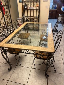 Marble/glass:wrought iron dining set