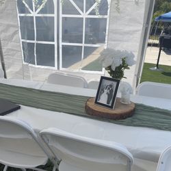 center piece vases with white flowers and with rocks 