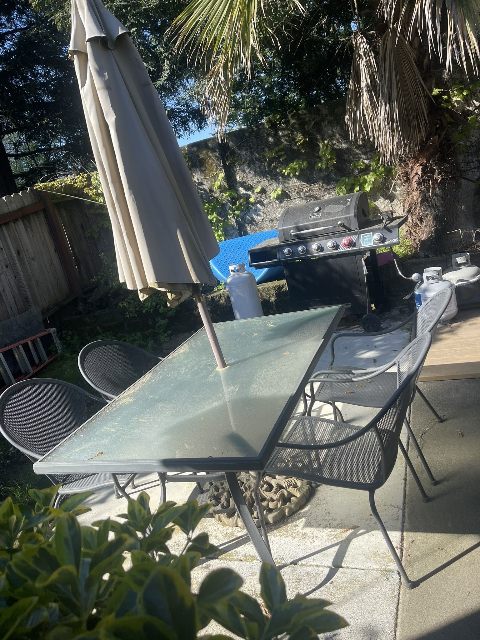 Nice Outdoor Table With Umbrella And Four Chairs