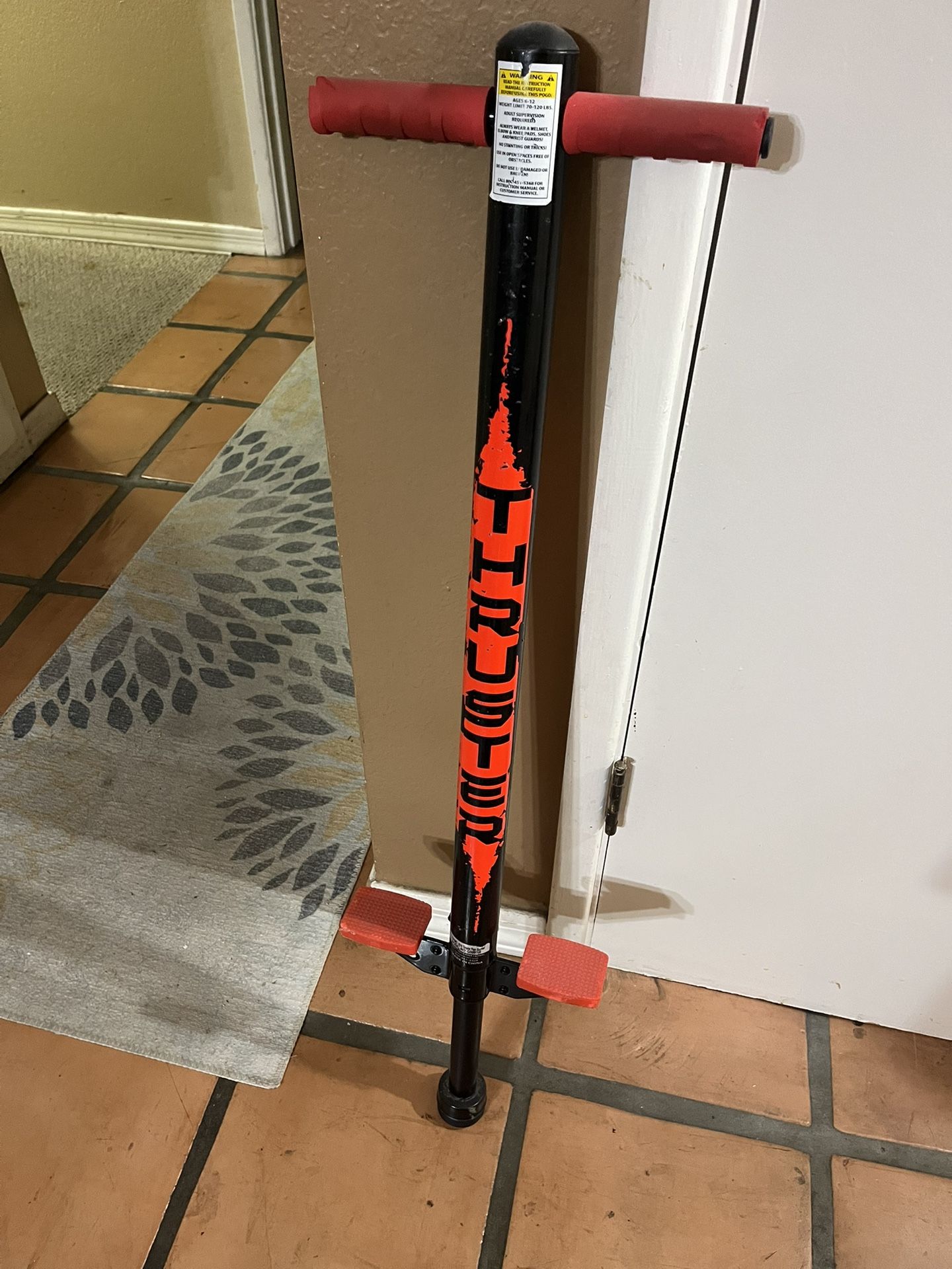 Red And Black Thruster Pogo Stick